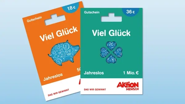 Abbildung von zwei Jahreslos-Gutscheinen. Ein Gutschein mit einem Glücksschwein darauf und der andere mit einem vierblättrigen Kleeblatt.